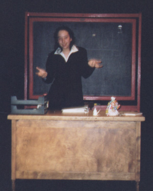 Maya Bourdeau as The Professor.